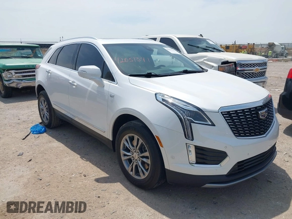 2021 Cadillac XT5 FWD Premium Luxury z VIN 1GYKNCR42MZ174309, wystawiony jako IAAI lot #42051341 z przebiegiem 75 544 mil mil oraz . Historia ofert i sprzedaży dostępna na DreamBid. Obrazek 1.