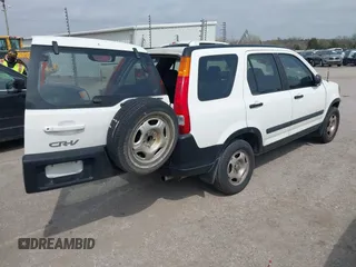 2004 Honda CR-V LX with VIN JHLRD68454C004803, listed as a IAAI auction lot 41910388 with 192,766 mi miles and . Bid and sale history available at carsss.com. Image 4.