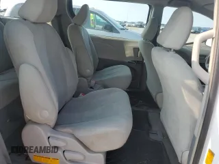 2013 Toyota Sienna L z VIN 5TDZK3DC7DS289663, wystawiony jako Copart lot #59146295 z przebiegiem 124 876 mil mil oraz Szkoda całkowita • Salvage title. Historia ofert i sprzedaży dostępna na DreamBid. Obrazek 11.