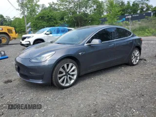 2018 Tesla Model 3 Long Range Battery z VIN 5YJ3E1EA3JF052831, wystawiony jako Copart lot #60656495 z przebiegiem 140 088 mil mil oraz Szkoda całkowita • Salvage title. Historia ofert i sprzedaży dostępna na DreamBid. Obrazek 1.
