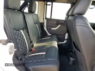 2015 Jeep Wrangler Unlimited Sport with VIN 1C4BJWDG9FL759012, listed as a Copart auction lot 61002465 with 101,395 mi miles and Salvage title. Bid and sale history available at DreamBid. Image 11.