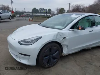 2018 Tesla Model 3 Long Range Battery with VIN 5YJ3E1EB4JF086012, listed as a IAAI auction lot 41683859 with 52,059 mi miles and . Bid and sale history available at DreamBid. Image 6.