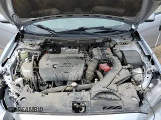 2014 Mitsubishi Lancer SE z VIN JA32V2FW3EU602908, wystawiony jako Copart lot #60148705 z przebiegiem 188 938 mil mil oraz Szkoda całkowita • Salvage title. Historia ofert i sprzedaży dostępna na DreamBid. Obrazek 11.