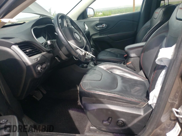 2014 Jeep Cherokee Trailhawk with VIN 1C4PJMBS6EW140981, listed as a Copart auction lot 58260325 with 97,036 mi miles and Salvage title. Bid and sale history available at DreamBid. Image 7.
