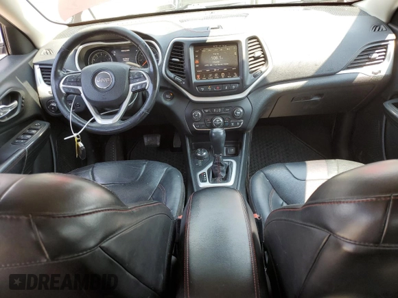 2015 Jeep Cherokee Trailhawk with VIN 1C4PJMBSXFW661218, listed as a Copart auction lot 61364895 with 139,200 mi miles and Salvage title. Bid and sale history available at DreamBid. Image 8.