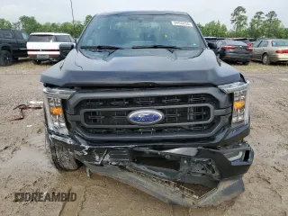 2023 Ford F-150 XL with VIN 1FTEW1C59PFC27499, listed as a Copart auction lot 54453255 with 58,554 mi miles and Salvage title. Bid and sale history available at DreamBid. Image 5.