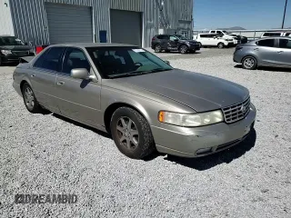 2000 Cadillac Seville Touring STS z VIN 1G6KY5498YU255607, wystawiony jako Copart lot #71130714 z przebiegiem 146 046 mil mil oraz Szkoda całkowita • Salvage title. Historia ofert i sprzedaży dostępna na DreamBid. Obrazek 11.
