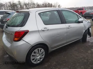 2015 Toyota Yaris L with VIN VNKKTUD33FA028588, listed as a IAAI auction lot 41575230 with 148,071 mi miles. Bid and sale history available at carsss.com. Image 4.