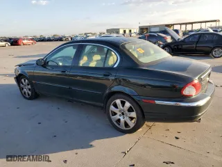 2004 Jaguar X-Type with VIN SAJEA51C24WE14915, listed as a Copart auction lot 77828734 with 0 mi miles and Salvage Title. Bid and sale history available at carsss.com. Image 2.