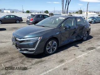 2018 Honda Clarity Touring z VIN JHMZC5F32JC000853, wystawiony jako Copart lot #63232685 z przebiegiem 91 060 mil mil oraz Szkoda całkowita • Salvage title. Historia ofert i sprzedaży dostępna na DreamBid. Obrazek 1.