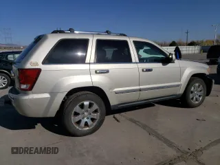 2010 Jeep Grand Cherokee Limited with VIN 1J4RR5GT3AC135686, listed as a Copart auction lot 52961465 with 136,034 mi miles and Salvage title. Bid and sale history available at DreamBid. Image 3.