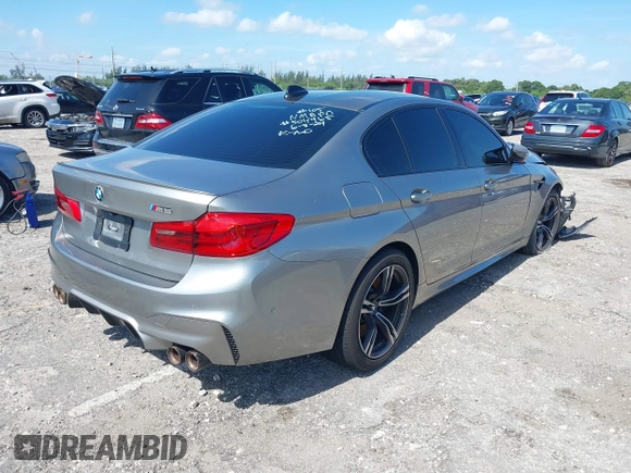 2019 BMW M5 Competition z VIN WBSJF0C50KB285924, wystawiony jako IAAI lot #41686677 z przebiegiem 44 238 mil mil oraz . Historia ofert i sprzedaży dostępna na DreamBid. Obrazek 4.