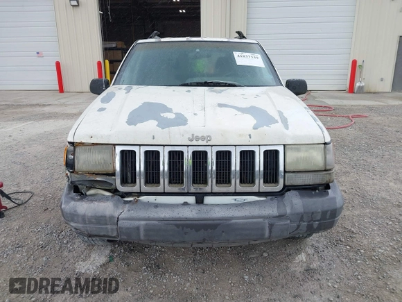 1996 Jeep Grand Cherokee Laredo with VIN 1J4FX58S1TC278511, listed as a IAAI auction lot 41837339 with 303,947 mi miles. Bid and sale history available at carsss.com. Image 6.