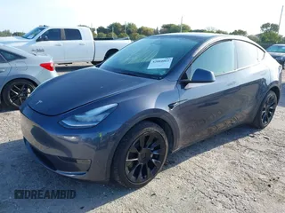 2023 Tesla Model Y Long Range z VIN 7SAYGDEE5PA099226, wystawiony jako IAAI lot #42004061 z przebiegiem 10 607 mil mil oraz . Historia ofert i sprzedaży dostępna na DreamBid. Obrazek 2.