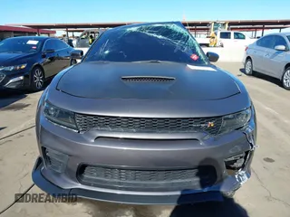2022 Dodge Charger Scat Pack Widebody with VIN 2C3CDXGJ1NH204130, listed as a IAAI auction lot 41392893 with 9,515 mi miles and . Bid and sale history available at DreamBid. Image 12.