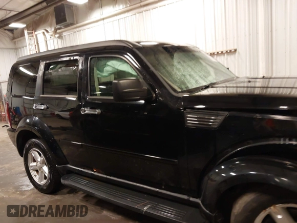 2007 Dodge Nitro SXT with VIN 1D8GU28K67W663621, listed as a IAAI auction lot 41691529 with 211,556 mi miles. Bid and sale history available at carsss.com. Image 14.