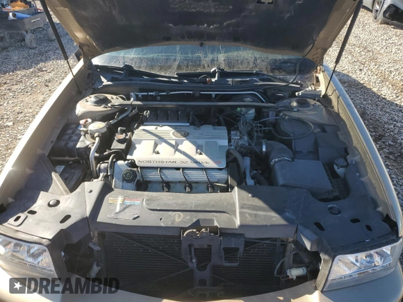 1999 Cadillac DeVille DHS z VIN 1G6KE54Y5XU721363, wystawiony jako Copart lot #79227924 z przebiegiem Nie podano mil oraz Szkoda całkowita • Salvage title. Historia ofert i sprzedaży dostępna na DreamBid. Obrazek 11.