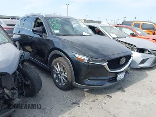 2020 Mazda CX-5 Grand Touring with VIN JM3KFADM3L1819939, listed as a IAAI auction lot 42749920 with 35,407 mi miles and . Bid and sale history available at DreamBid. Image 1.