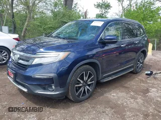 2019 Honda Pilot Touring 7-Passenger z VIN 5FNYF6H63KB000365, wystawiony jako IAAI lot #42154822 z przebiegiem 238 032 mil mil oraz . Historia ofert i sprzedaży dostępna na DreamBid. Obrazek 18.
