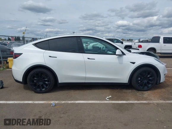 2022 Tesla Model Y Long Range with VIN 7SAYGDEE2NF403354, listed as a IAAI auction lot 41986216 with 53,177 mi miles and . Bid and sale history available at DreamBid. Image 13.