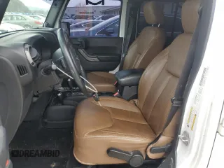 2013 Jeep Wrangler Unlimited Moab with VIN 1C4BJWEG6DL583841, listed as a Copart auction lot 52487915 with 130,369 mi miles and Salvage title. Bid and sale history available at DreamBid. Image 7.