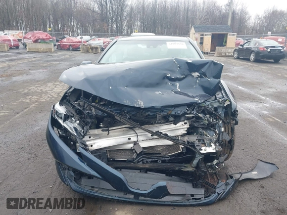 2020 Toyota Camry LE with VIN 4T1L11AK3LU977805, listed as a IAAI auction lot 41907558 with 82,237 mi miles and . Bid and sale history available at DreamBid. Image 13.