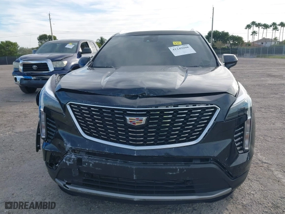 2020 Cadillac XT4 FWD Premium Luxury with VIN 1GYFZCR44LF070832, listed as a IAAI auction lot 41249608 with 77,471 mi miles. Bid and sale history available at carsss.com. Image 6.