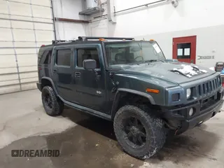 2005 Hummer H2 SUV with VIN 5GRGN23U65H132505, listed as a IAAI auction lot 41515346 with 140,944 mi miles. Bid and sale history available at carsss.com. Image 1.