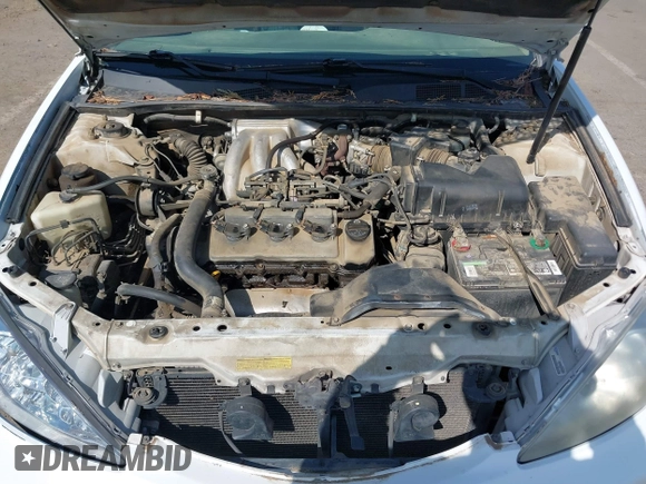 2002 Toyota Camry XLE z VIN 4T1BF32K22U032074, wystawiony jako IAAI lot #42153774 z przebiegiem 293 541 mil mil oraz . Historia ofert i sprzedaży dostępna na DreamBid. Obrazek 10.