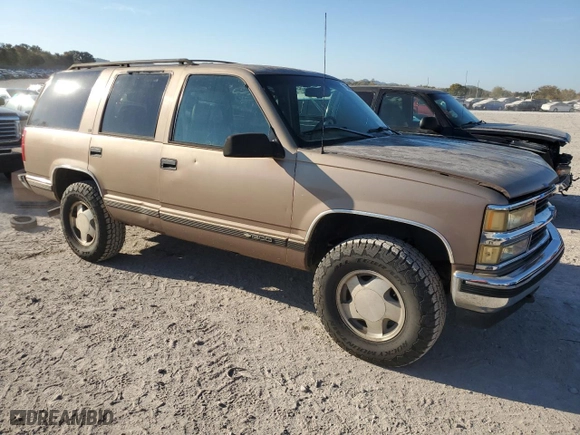 1996 Chevrolet Tahoe with VIN 1GNEK13R1TJ385350, listed as a Copart auction lot 77593884 with 169,178 mi miles and Salvage Title. Bid and sale history available at carsss.com. Image 4.