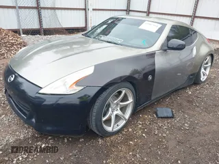 2009 Nissan 370Z Touring with VIN JN1AZ44E69M404341, listed as a IAAI auction lot 41907551 with 144,612 mi miles and . Bid and sale history available at DreamBid. Image 2.