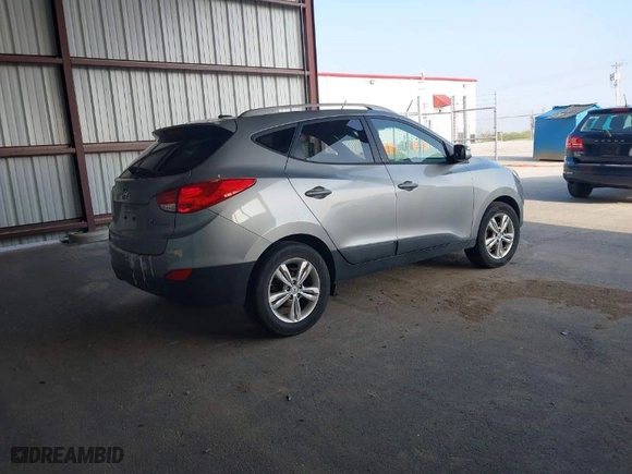 2013 Hyundai Tucson GLS with VIN KM8JU3AC6DU769194, listed as a IAAI auction lot 42018641 with 169,537 mi miles. Bid and sale history available at carsss.com. Image 4.