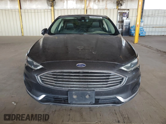 2020 Ford Fusion SEL z VIN 3FA6P0CD3LR131180, wystawiony jako Copart lot #63843355 z przebiegiem 146 705 mil mil oraz Czysty tytuł • Clean title. Historia ofert i sprzedaży dostępna na DreamBid. Obrazek 5.