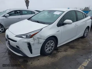2021 Toyota Prius L Eco with VIN JTDKAMFU6M3141019, listed as a IAAI auction lot 41821212 with 202,756 mi miles. Bid and sale history available at carsss.com. Image 2.