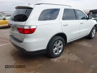 2013 Dodge Durango Crew with VIN 1C4RDHDG0DC535397, listed as a IAAI auction lot 41036306 with 163,571 mi miles. Bid and sale history available at carsss.com. Image 4.