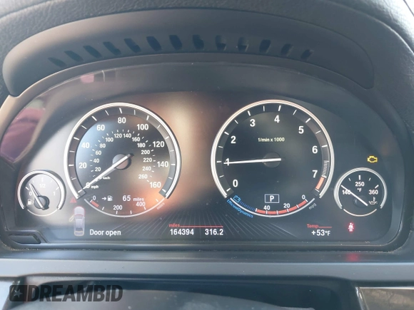 2013 BMW 7 Series 740i with VIN WBAYA6C55DC995094, listed as a IAAI auction lot 41246796 with 164,394 mi miles. Bid and sale history available at carsss.com. Image 7.