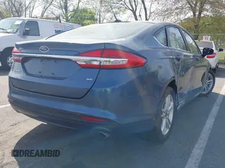 2018 Ford Fusion SE z VIN 3FA6P0H74JR176113, wystawiony jako IAAI lot #42074916 z przebiegiem 78 940 mil mil oraz . Historia ofert i sprzedaży dostępna na DreamBid. Obrazek 4.