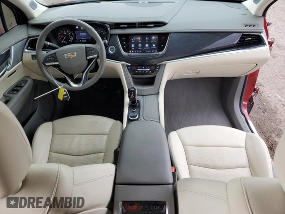 2024 Cadillac XT6 FWD Premium Luxury with VIN 1GYKPCRS1RZ700168, listed as a Copart auction lot 59327055 with 21,001 mi miles and Salvage title. Bid and sale history available at DreamBid. Image 8.