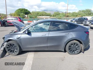 2023 Tesla Model Y Long Range z VIN 7SAYGAEE4PF945847, wystawiony jako IAAI lot #41071924 z przebiegiem 33 454 mil mil oraz . Historia ofert i sprzedaży dostępna na DreamBid. Obrazek 15.