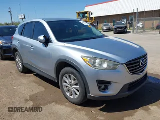 2016 Mazda CX-5 Touring z VIN JM3KE2CY2G0725785, wystawiony jako IAAI lot #41997112 z przebiegiem 167 823 mil mil oraz . Historia ofert i sprzedaży dostępna na DreamBid. Obrazek 1.