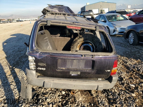 1997 Jeep Grand Cherokee Laredo with VIN 1J4GZ58Y0VC547880, listed as a Copart auction lot 79866684 with 0 mi miles and Salvage Title. Bid and sale history available at carsss.com. Image 6.