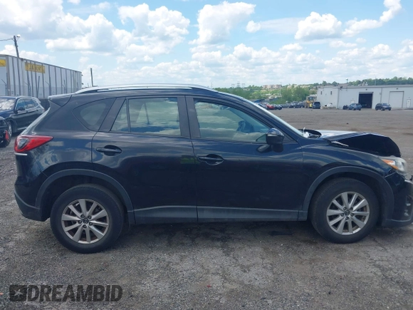 2016 Mazda CX-5 Sport with VIN JM3KE4BY2G0796577, listed as a IAAI auction lot 42230645 with 103,223 mi miles and . Bid and sale history available at DreamBid. Image 12.