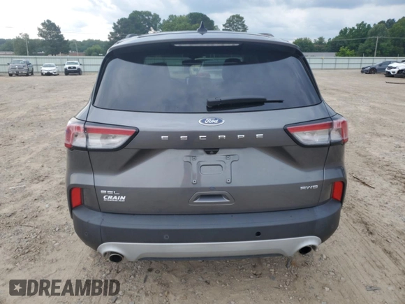2021 Ford Escape SEL with VIN 1FMCU9H68MUB09069, listed as a Copart auction lot 58760215 with 27,694 mi miles and Salvage title. Bid and sale history available at DreamBid. Image 6.