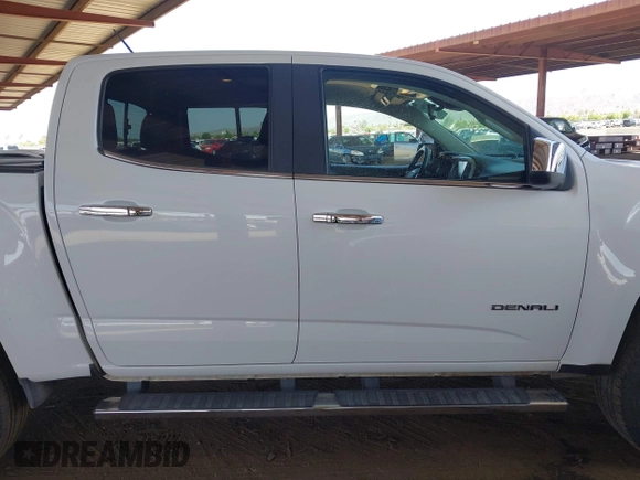 2018 GMC Canyon 4WD Denali z VIN 1GTP6EE11J1178961, wystawiony jako IAAI lot #42499884 z przebiegiem 71 309 mil mil oraz . Historia ofert i sprzedaży dostępna na DreamBid. Obrazek 13.