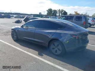 2023 Tesla Model 3 with VIN 5YJ3E1EA6PF701109, listed as a IAAI auction lot 40491628 with 9,989 mi miles. Bid and sale history available at carsss.com. Image 3.