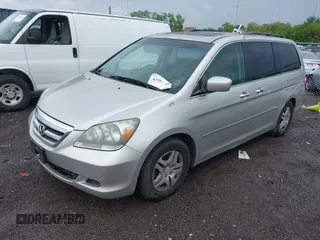 2007 Honda Odyssey EX-L with VIN 5FNRL38787B455417, listed as a IAAI auction lot 42104303 with 214,482 mi miles and . Bid and sale history available at DreamBid. Image 2.