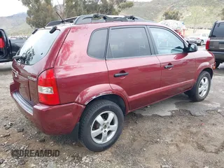 2006 Hyundai Tucson GL with VIN KM8JM12BX6U431424, listed as a IAAI auction lot 41769787 with 125,218 mi miles. Bid and sale history available at carsss.com. Image 4.