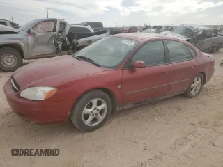 2000 Ford Taurus SES with VIN 1FAFP55S6YG242913, listed as a Copart auction lot 54494505 with 165,263 mi miles and Salvage title. Bid and sale history available at DreamBid. Image 1.