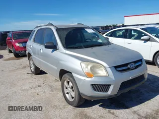 2009 Kia Sportage LX with VIN KNDJF724X97556574, listed as a IAAI auction lot 42206080 with 115,868 mi miles and . Bid and sale history available at carsss.com. Image 1.