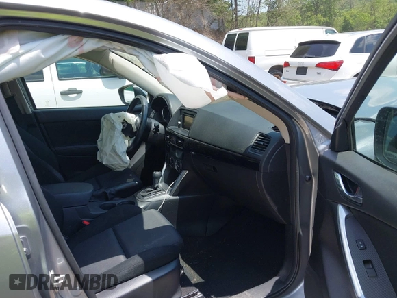 2014 Mazda CX-5 Sport with VIN JM3KE2BEXE0329303, listed as a IAAI auction lot 42556908 with 127,836 mi miles and . Bid and sale history available at DreamBid. Image 5.